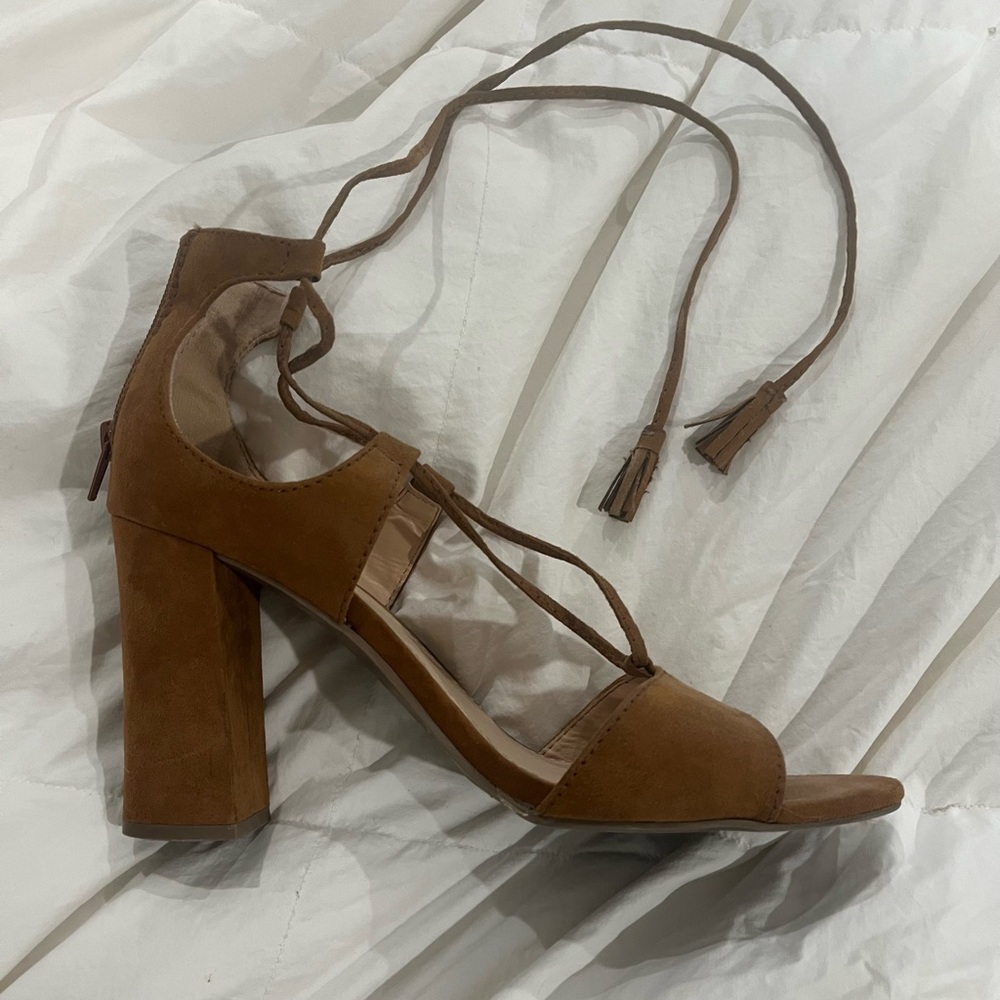 Rarely worn size 9 ankle tie sandals with 3” heels. Rust colored suede.